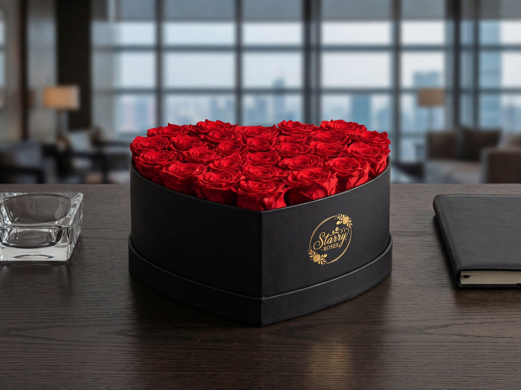 Large Heart Black Box Red Forever Roses as a luxury gift displayed in a rich interior setting. Lifestyle photo showing a perfect gift for anniversaries and special occasions.