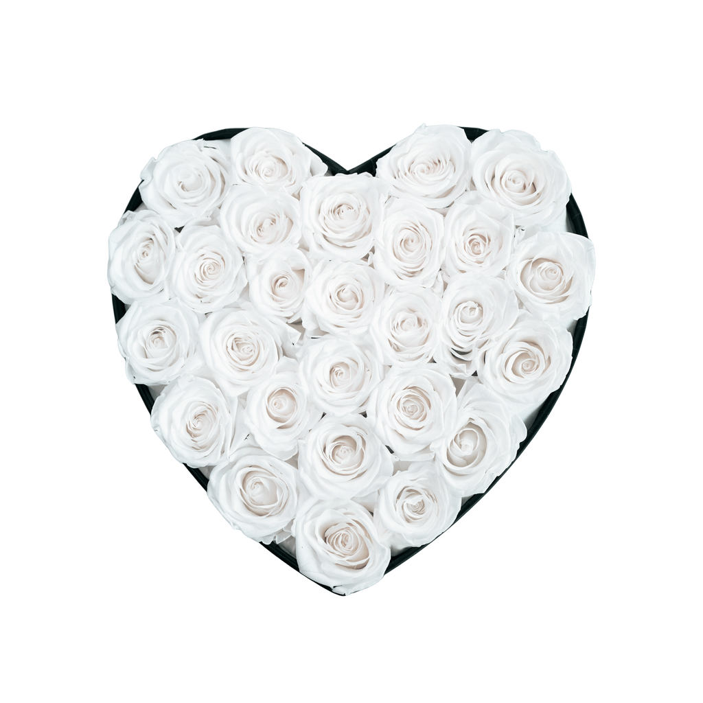 Large Heart Black Box White Forever Roses flat lay overhead view.