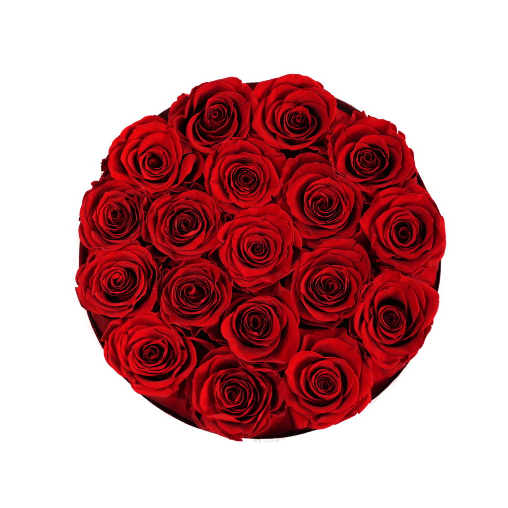 Large Round White Box Red Forever Roses flat lay overhead view.