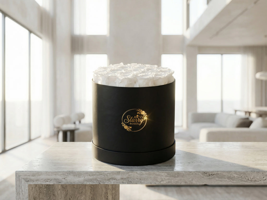 Large Round Black Box White Forever Roses as a luxury gift displayed in a rich interior setting. Lifestyle photo showing a perfect gift for anniversaries and special occasions.