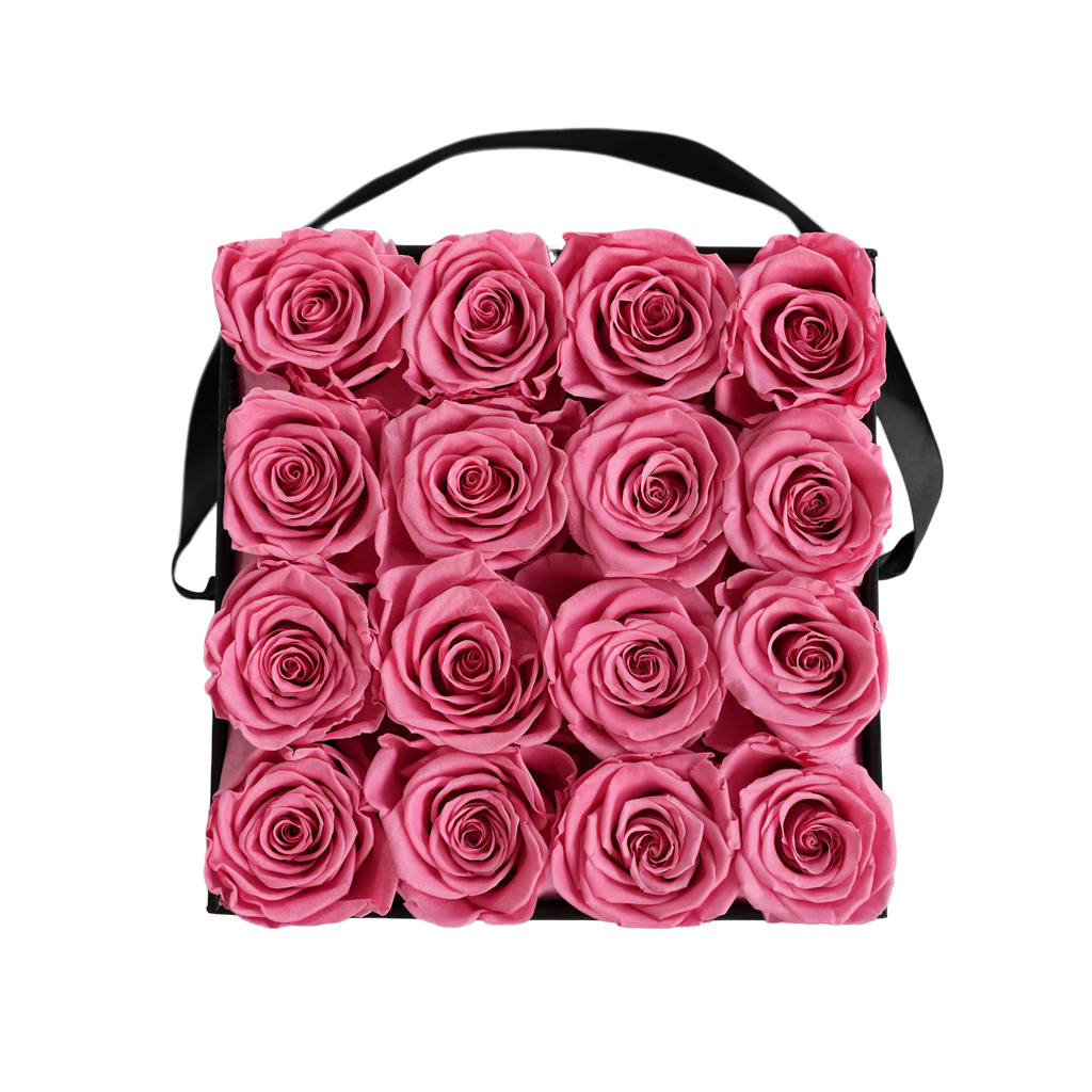 Large Square Black Box Pink Forever Roses flat lay overhead view.