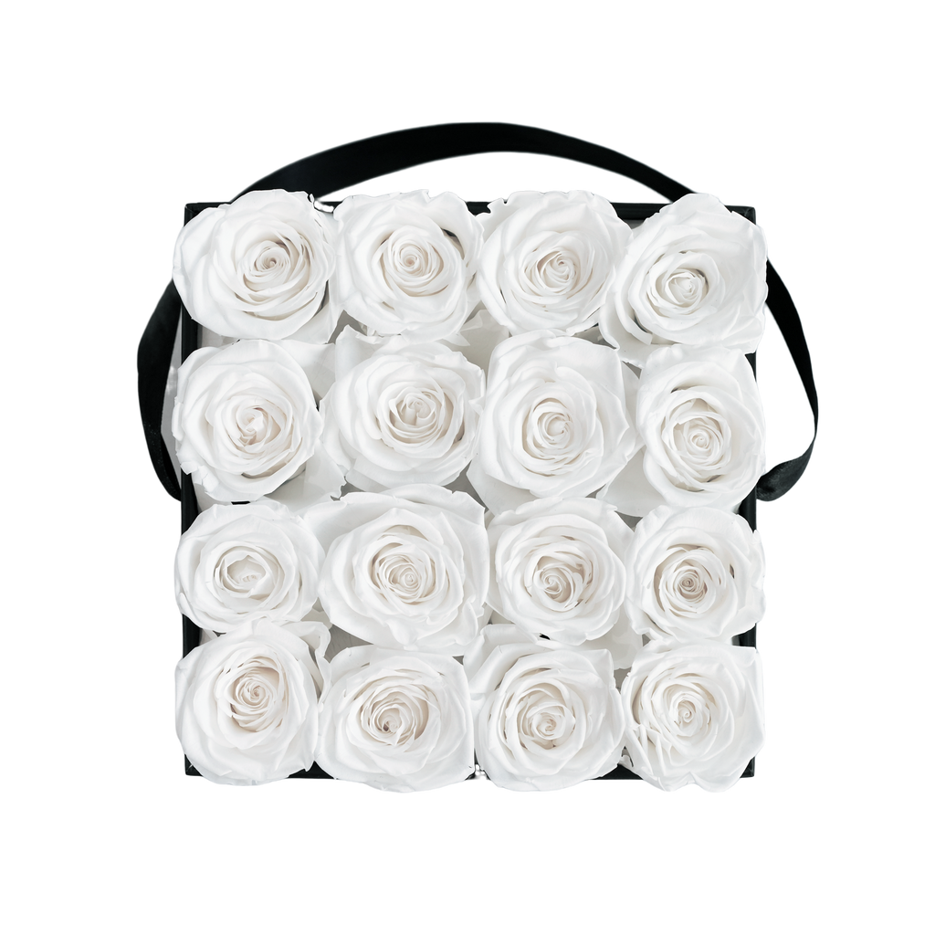 Large Square Black Box White Forever Roses flat lay overhead view.
