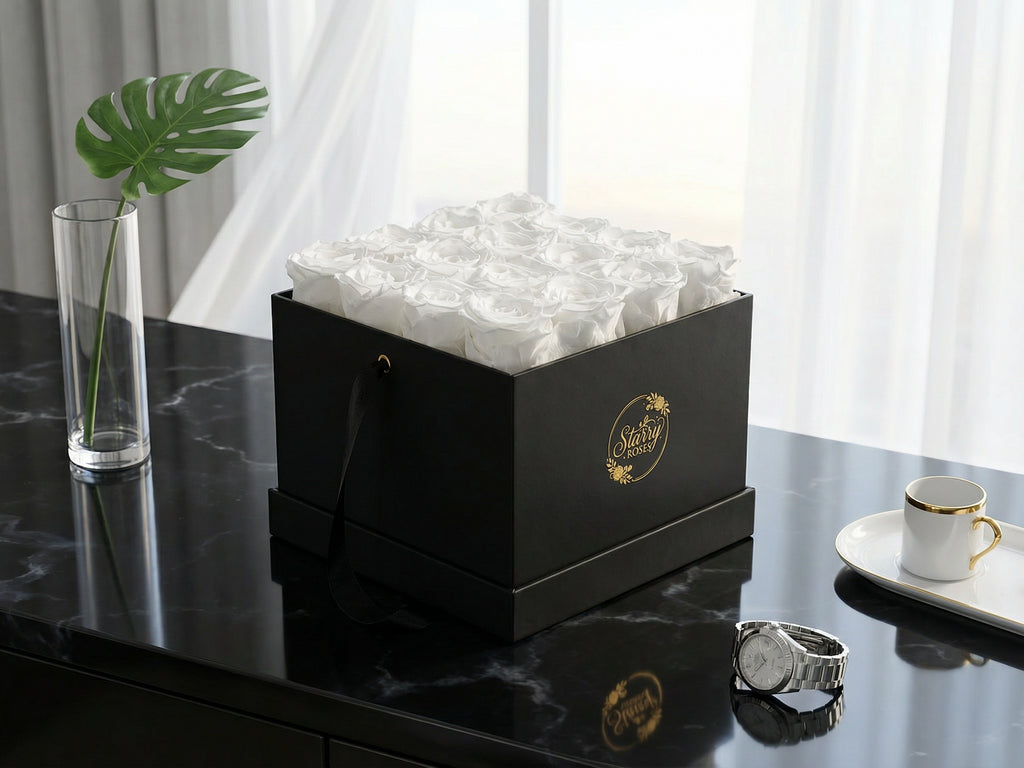Large Square Black Box White Forever Roses Box as a luxury gift displayed in a rich interior setting. Lifestyle photo showing a perfect gift for anniversaries and special occasions.