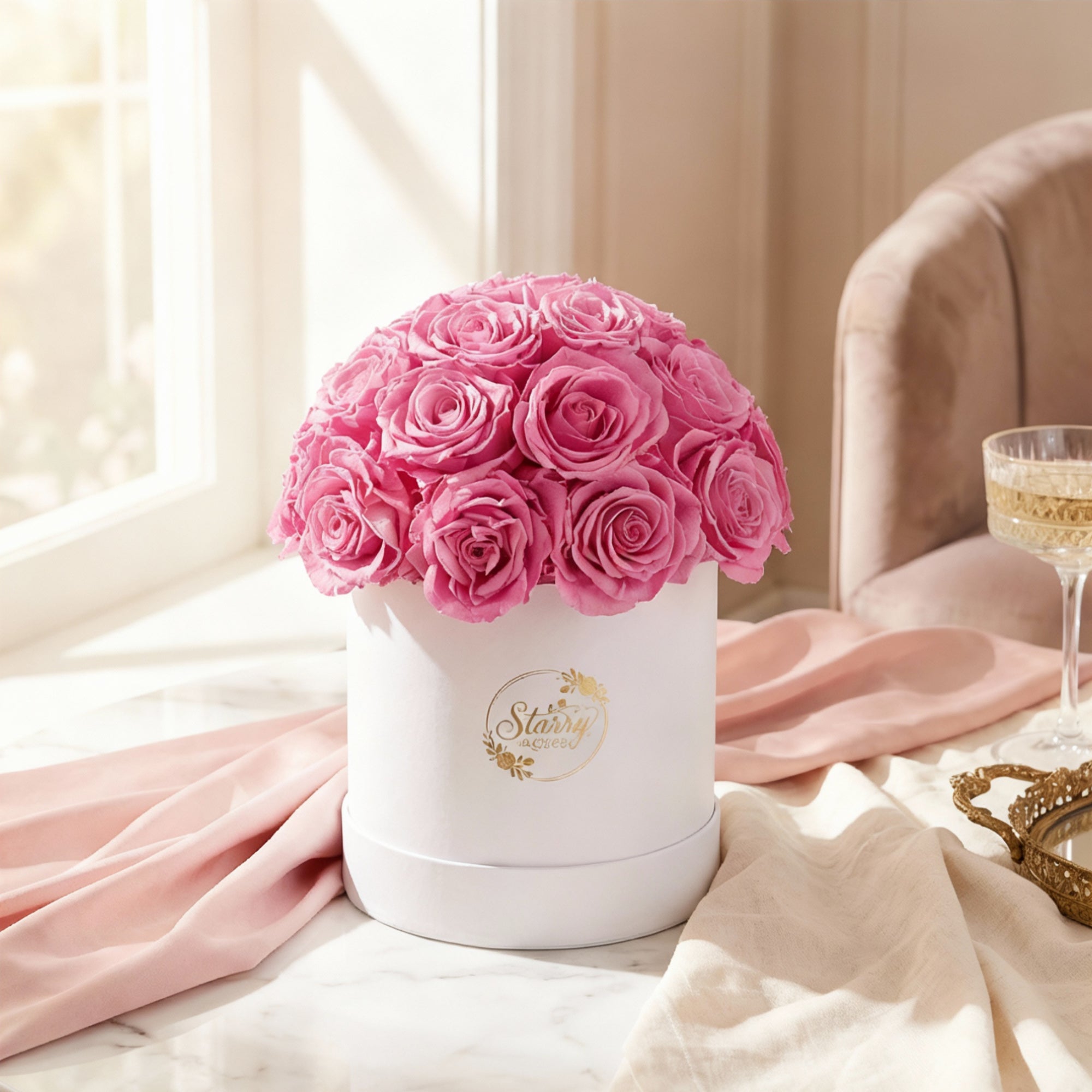 Large Superdome White Box Pink Forever Roses as a luxury gift displayed in a rich interior setting. Lifestyle photo showing a perfect gift for anniversaries and special occasions.