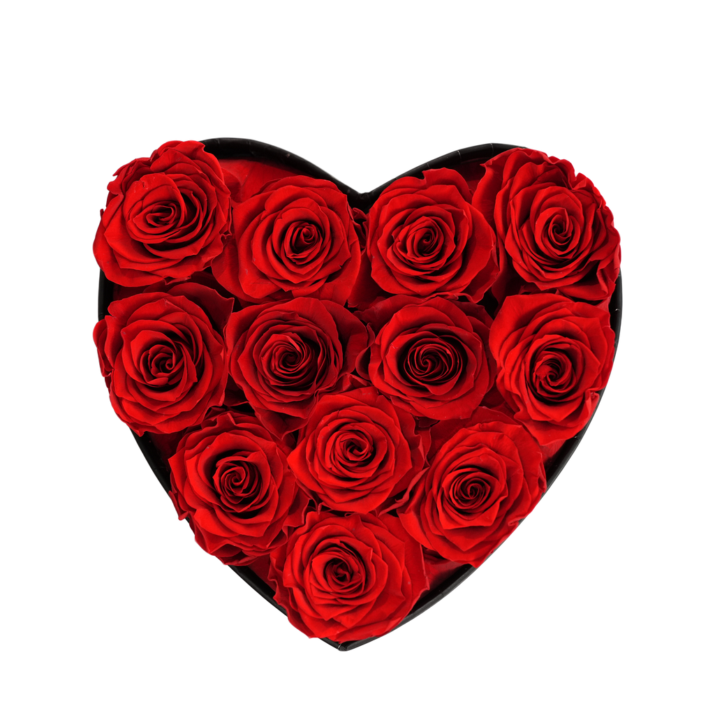 Small Heart Black Box Red Forever Roses flat lay overhead view.