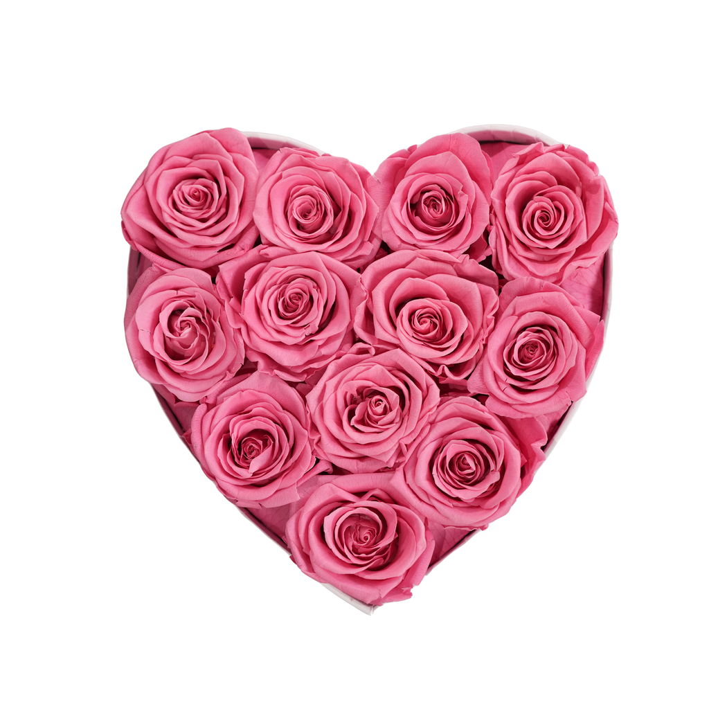 Small Heart White Box Pink Forever Roses flat lay overhead view.